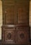 Old vintage wardrobe furniture with ornamental doors and retro colors of wooden surfaces