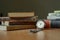 Old vintage watch and some books on a table