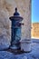 Old vintage water pump in Castillo Santa Barbara, Alicante, Spain.