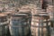 Old vintage whisky barrels filled of whiskey placed in order in