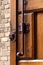 Old vintage wood door lock lock rusty brown brick wall forged wooden gate valve latch bolt catch