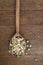 Old, vintage wooden spoon with legumes, beans, pulses. Rustic ba