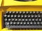 Old vintage yellow typewriter in Slovak. Close up