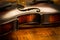 Old violin in vintage style on wood