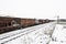 Old wagons on the railway in the snow in winter.