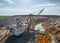 Old walking dragline with bucket operates in chalkquarry