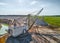 Old walking dragline with bucket operates in chalkquarry