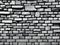 old wall with a black and white bricks, AI Generated
