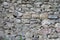 Old wall of bricks and stones. Gray stone wall