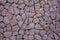 An old wall of bright red marble stones of various shapes and sizes. rough surface texture