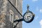 Old wall clock downtown in Canterbury city, England