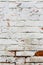 Old wall, cracked and dirty, bricks. White color vertical design background