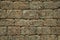 Old wall made of stone bricks forming a charming background