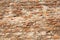 Old Wall of Red Bricks and White Brayed and Cracked Old Paint. Red, Terracotta and White Brick Background. Old Wall for Background