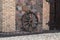 Old wall of a rustic barn made of chipped stone. Fragment.