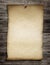 Old wanted paper or parchment pinned by nail to wooden wall