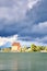 Old warehouse as a hotel on Ziegelsee in Schwerin under dramatic clouds. Mecklenburg-Western Pomerania, Germany