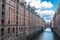 Old warehouses next to a canal in HafenCity, Hamburg, Germany