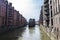 Old warehouses next to a canal in HafenCity, Hamburg, Germany