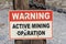 Old Warning Active Mining Operation Sign