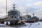 Old warships on the shore at the Maritime Museum Seaplane in Tallinn in winter. Estonia