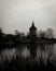 An old water tower is placed on a small hill in a public park called Pildammsparken in MalmÃ¶, Sweden. Here seen on a dark spring