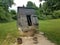 Old water well with wood cover and buckets