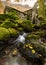 Old watermill with waterfall in foreground. Borrowdale, Lake District, UK.