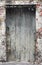 Old weathered deteriorated wooden door