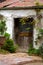 Old weathered door on a derelict outbuilding