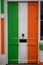 Old weathered door painted in colors of Irish National flag. Rich saturated colors. Expression of pride, love and patriotism to