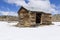 Old weathered Ghost Town buildings in the desert during winter with snow.