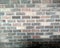 Old and weathered grungy yellow and red brick wall as seamless pattern texture background.