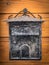 Old weathered mailbox hanging on a wooden door