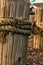 Old weathered marine timber pilings with worn thick rope, nautical, background,copy space, concept