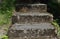 Old weathered stone steps covered in moss - finding a secret ancient place