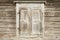 Old weathered traditional wooden window shutters.