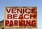 An old weathered Venice Beach parking sign