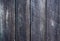 Old weathered vertical wooden planks background closeup