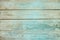 Old weathered wood plank painted in blue