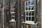 Old,weathered wood wall with glass paned windows