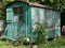 Old weathered wooden contractor`s shed in the garden