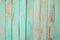 Old weathered wooden plank painted in turquoise blue pastel color