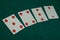 Old west era playing card on gambling table. 5,4,3,2 of diamonds