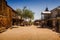 Old Western Goldfield Ghost Town square with huge cactus and saloon, photo taken during the sunny day
