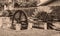 Old wheels of a watermill. Vintage style picture. Adding grain t
