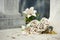 Old white fake flower on grave