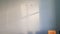 Old white plastering wall surface with blurry geometric shadows