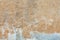 Old whitewashed background texture of a weathered distressed cracked concrete cement stone wal