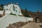 Old whitewashed house and arched gateway in the city stone wall